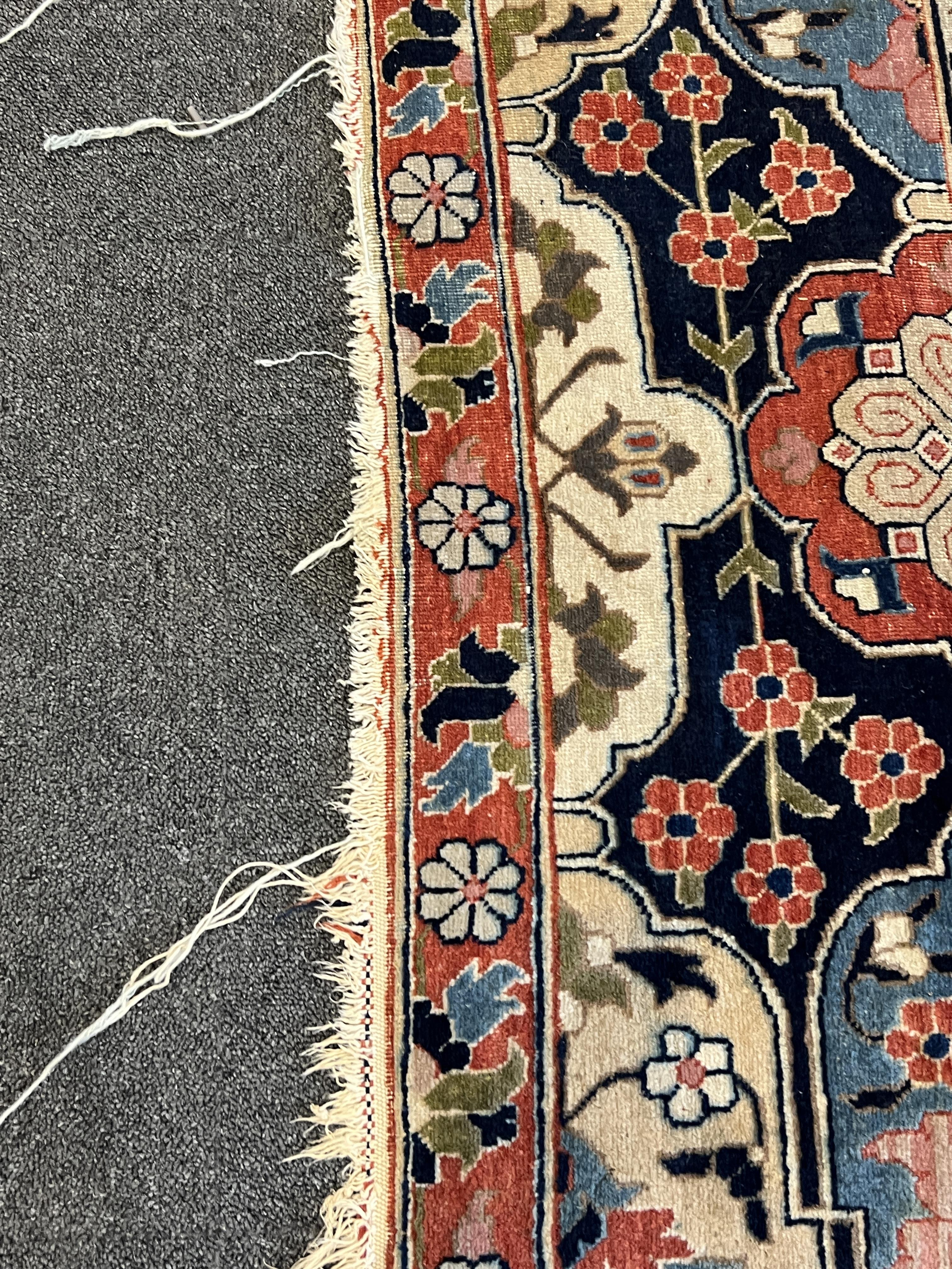 An early 20th century Benlian Tabriz carpet, signed Mahmud, 320 x 225cm